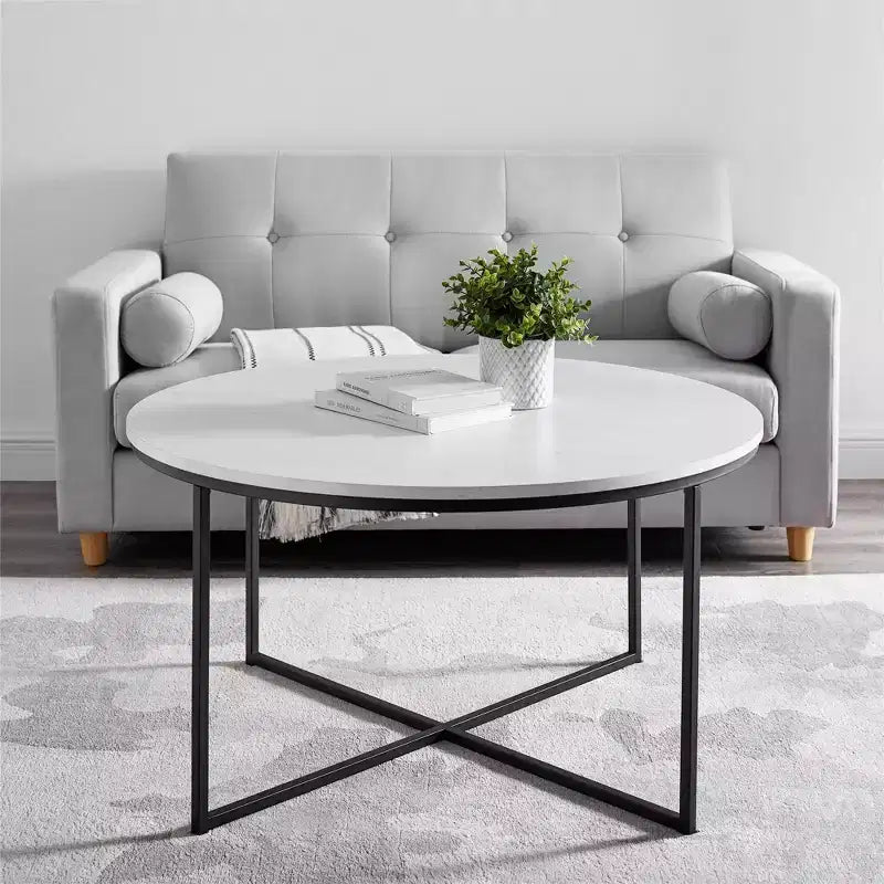 Table basse ronde à pieds croisés