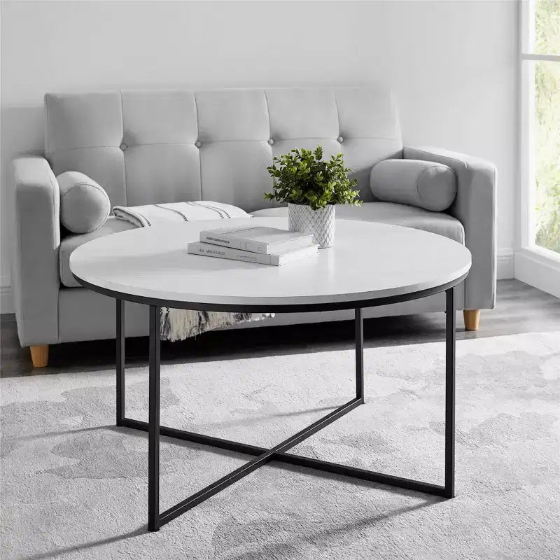 Table basse ronde à pieds croisés